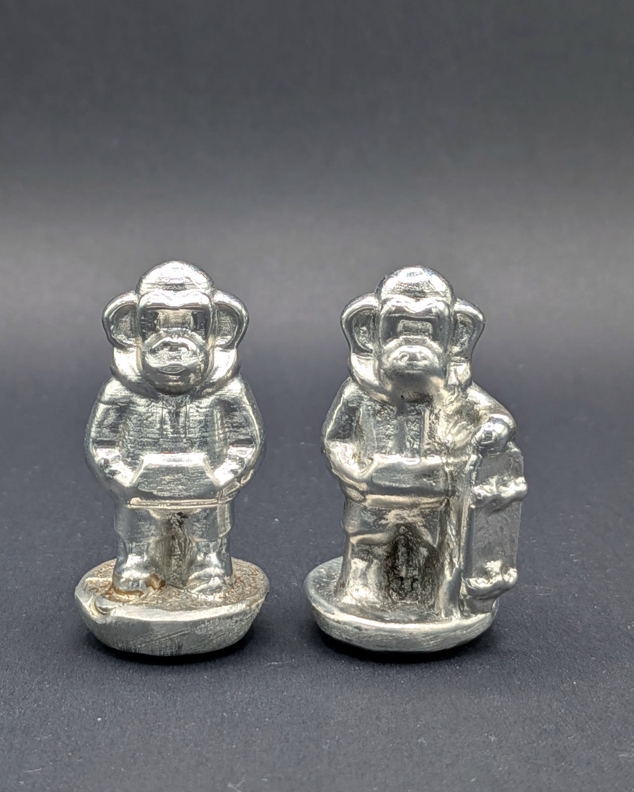 Tin Survivors — hand-cast tin figure, raw surface
